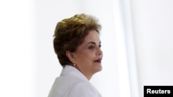 FILE - Brazil's President Dilma Rousseff attends a meeting with educators at the Planalto Palace in Brasilia, Brazil, April 12, 2016. The Brazilian Senate Tuesday will begin voting on whether or not to begin an impeachment trial of embattled President Dilma Rousseff that could officially hand over power to her former vice president — current interim president — Michel Temer.