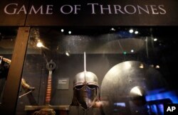 FILE - In this is June 10, 2014 file photo of weapons from the "Game of Thrones" are displayed at the Waterfront Hall, Belfast, Northern Ireland.