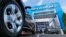 FILE - The logo on the wheel of an SUVappears in front of a Chevrolet dealership in Richmond, Va., April 26, 2017. 