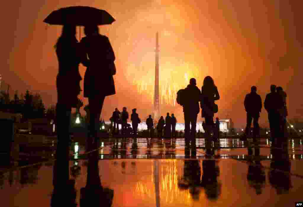 April 12: Spectators watch fireworks celebrating the 50th anniversary of Yuri Gagarin's historic space flight, in Moscow's Victory Park. (Reuters/Nikolay Korchekov)