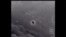 FILE - Image from video provided by the Department of Defense labelled Gimbal, from 2015, an unexplained object is seen at center as it is tracked as it soars high along the clouds, traveling against the wind. 