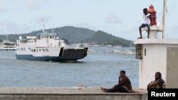 A boat arrives at Dzaoudzi on the Indian Ocean island of Mayotte, March 31, 2012. 