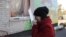 FILE - A woman cries outside a local kindergarten, which was damaged by explosions at a military depot in Svatove, Luhansk region, Ukraine, Oct. 30, 2015.