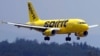 FILE - A Spirit Airlines 319 Airbus approaches Manchester Boston Regional Airport for a landing, June 2, 2023, in Manchester, N.H. Spirit has lost more than $2.5 billion since the start of 2020 and faces looming debt payments totaling more than $1 billion over the next year.