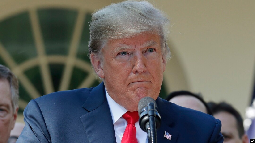 President Donald Trump pauses as he takes questions from members of the media about Supreme Court nominee Judge Brett Kavanaugh in the Rose Garden of the White House in Washington, Oct. 1, 2018. 