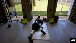 U.S. Army Sergeant Josh Olson takes practice on the shooting range at Fort Benning, Georgia and he trains for the upcoming Paralympic Games, May 30, 2012.