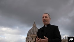 Monsignor John Kennedy, the head of the Congregation for the Doctrine of the Faith discipline section, speaks during an interview on the terrace of the section's offices at the Vatican, Dec. 9, 2019. 