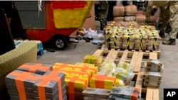 In this photo released March 31, 2020, by the San Diego Tunnel Task Force, Department of Homeland Security, a large haul of drugs that were seized in a cross-border tunnel running from warehouses in Tijuana, Mexico to San Diego are displayed in San Diego.