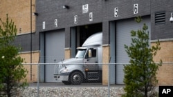 A truck is shown at the Pfizer Global Supply Kalamazoo manufacturing plant in Portage, Mich., Saturday, Dec. 12, 2020. (AP Photo/Paul Sancya)