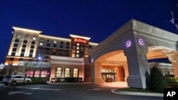 FILE - This March 30, 2016, photo shows a Hilton hotel in Richmond, Virginia. China's HNA Group is buying an approximately 25 percent stake in hotel operator Hilton from Blackstone affiliates in a deal worth about $6.5 billion, in a deal announced Oct. 24, 2016.