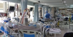 FILE - Patients with coronavirus disease (COVID-19) lie in beds at the ICU of Sasan Hospital, in Tehran, Iran, March 30, 2020.