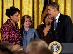 FILE - U.S. President Barack Obama talks to James Byrd's sisters Louvon Harris, left, and Betty Byrd Baotner, second right, and Matthew Shepard's mother, Judy Shepard, at a reception commemorating the enactment of the Matthew Shepard and James Byrd Jr. Hate Crimes Prevention Act, Oct. 28, 2009.