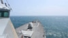 In this photo provided by the U.S. Navy, the Arleigh Burke-class guided-missile destroyer USS Halsey conducts routine underway operations while transiting through the Taiwan Strait on May 8, 2024. 