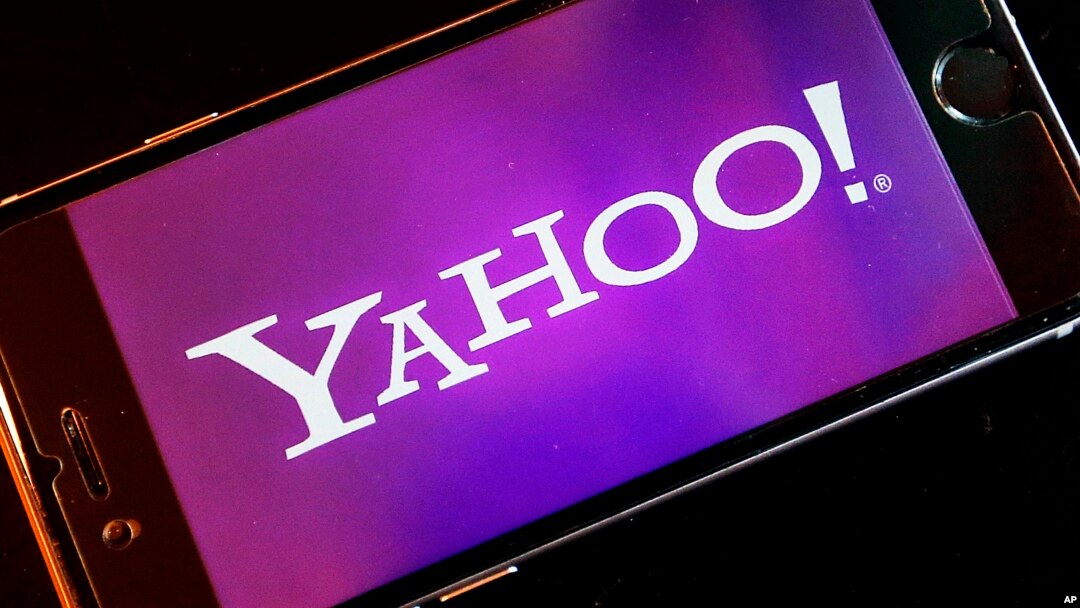 FILE - Yahoo logo appears on a smartphone. The company was acquired by Verizon Tuesday.