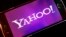 FILE - Yahoo logo appears on a smartphone. The company was acquired by Verizon Tuesday.