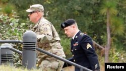 Sgt. Robert B. Bergdahl (R) arrives at the court house for a hearing in the case of United States vs. Bergdahl in Fort Bragg, North Carolina, U.S., Oct. 16, 2017. 