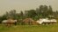 A Bangladeshi patrol from the United Nations Organization Stabilization Mission in the Democratic Republic of the Congo (MONUSCO) passes by Congolese soldiers in Gety, near Kaswara, Ituri province, on Jan. 26, 2016. Renewed fighting in the province has killed dozens of people and created a wave of refugees.