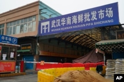 FILE - The Wuhan Huanan Wholesale Seafood Market, where a number of people fell ill with a virus, sits closed in Wuhan, China, Jan. 21, 2020.