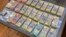 Money seized by Australian Federal Police are seen after its Operation Ironside against organised crime in this undated handout photo released June 8, 2021. Australian Federal Police/Handout via REUTERS 