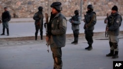 Afghan security forces inspect the site of two large bombings in Kabul, Afghanistan, Jan. 10, 2017. 