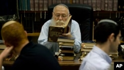 FILE - Israeli Rabbi Haim Drukman teaches Israeli youths during a lesson in his house in Merkaz Shapira, central Israel.