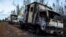 Burnt-out trucks are pictured on a rural road near Angol town, Temuco city, south of Santiago, Chile Aug. 7, 2015. Six trucks and heavy machinery of a forest company were burned in an arson attack in a rural area on the road between Angol and Collipulli