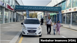 An Afghan family checks out the newly opened international trade center in Termez, Uzbekistan, Sept. 5, 2024.