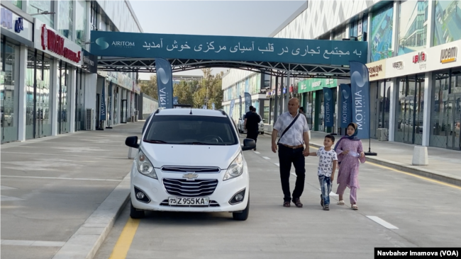 An Afghan family checks out the newly opened international trade center in Termez, Uzbekistan, Sept. 5, 2024.