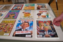 FILE - Copies of MAD are displayed at an exhibit celebrating its artistic legacy, May 3, 2018, in Columbus, Ohio.