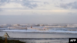 High surf from Hurricane Laura covers a jetty in Galveston, Texas on Aug. 27, 2020.