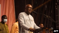 Burkina Faso President Roch Kabore addresses supporters during a celebration at the party’s headquarter in Ouagadougou, Nov. 26, 2020.