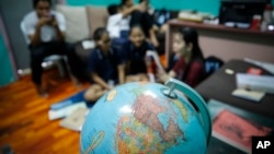 Christian Burmese refugees sit in a classroom in Kuala Lumpur, Malaysia, March 11, 2017. An Associated Press analysis suggests that the people hurt most by President Donald Trump's planned deep cuts in refugee visas are from not any of the six Muslim countries listed in his travel ban, but Myanmar.