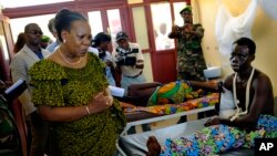 FILE - Interim President Catherine Samba-Panza visits victims at the general Hospital in Bangui, Central African Republic, June 1, 2014. 