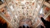 Visitors admire the Sistine Chapel of the Vatican Museums as the museum reopens, in Rome, Italy, May 3, 2021.