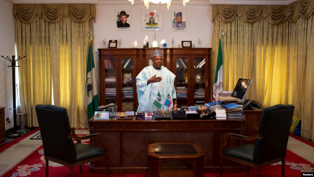 Governor of Borno state Kashim Shettima stands by his desk in the state house in Maiduguri May 22, 2014.