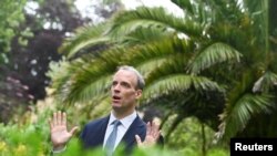 Britain's Foreign Secretary Dominic Raab gestures during an interview with Reuters on the sidelines of G7 summit in Carbis Bay, Cornwall, Britain, June 11, 2021.