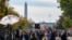 Journalists from all over the world wait for the result of the U.S. presidential elections on Black Lives Matter Plaza in front of the White House in Washington, D.C., Nov. 6, 2020.