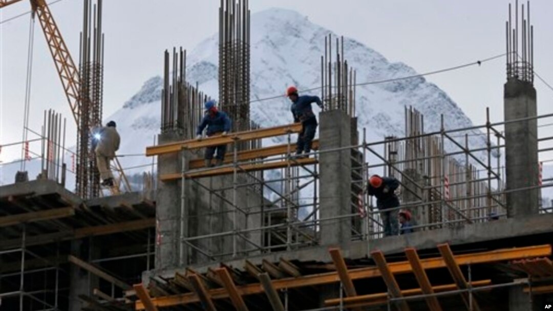 In preparation for the 2014 Winter Games at the Black Sea resort of Sochi, a hotel is under construction in nearby Krasnaya Polyana, Russia, Feb. 4, 2013.
