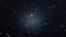 This image made with the Hubble Space Telescope shows the diffuse galaxy NGC 1052-DF2, lighter area in center, Nov. 16, 2017. Several other galaxies can be seen through it. The unusual galaxy’s stars are speeding around with no apparent influence from dark matter, according to a study published March 28, 2018, in the journal Nature.