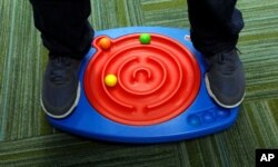 Toys like this double-maze board activity play system help develop motor skills, learning and concentration for autistic children.