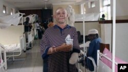 FILE - Albino Said Abdallah, who lost his left hand in an attack, is seen recovering at Morogoro hospital, Tanzania, May 7, 2010.