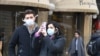 Tourists with protective mask visit Florence on February 25, 2020 as Tuscany reported its first two cases of COVID-19.