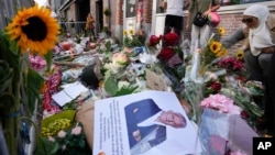 Journalist Peter R. De Vries' picture and flowers mark the spot where he was shot two days prior, in Amsterdam, Netherlands, July 8, 2021. De Vries was widely lauded for fearless reporting on the Dutch underworld.