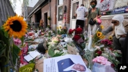 HIs picture and flowers mark the spot where journalist Peter R. de Vries was shot in Amsterdam, Netherlands, July 8, 2021. 