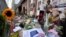 HIs picture and flowers mark the spot where journalist Peter R. de Vries was shot in Amsterdam, Netherlands, July 8, 2021. 