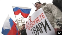 Supporters of the dominant United Russia party hold a rally against terrorism in St. Petersburg on March 31, 2010