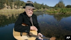 FILE - Merle Haggard poses at his ranch at Palo Cedro, California, Oct. 2, 2007.