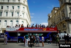 Tourists disembark from a Chinese-made double-decker Yutong bus in Havana,Feb. 10, 2017.