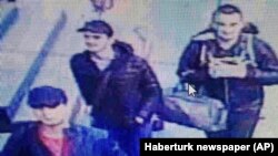 In this photo made from a video, people believed to be the attackers walk in Istanbul's Ataturk airport, June 28, 2016. Turkish authorities have banned distribution of images relating to the Ataturk airport attack within Turkey. 