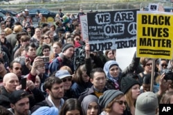 Demonstrators assemble outside the Trump International Hotel and Tower during an anti-Donald Trump protest in New York, March 19, 2016.